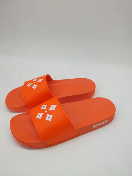 MSKP embossed sliders with cushioned sole and four-point emblem in limited edition design